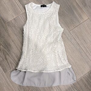 White sleeveless top